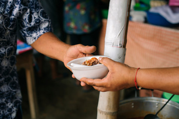 Social concept of poor people sharing : Concept serving free food to the poor : Free food, Using...