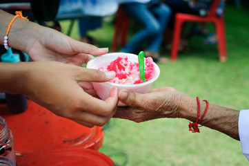 Free food for poor and homeless people donates food to food less people : The poor have been sharing food from the kinder society to Relieve Hunger : Social concept of poor people sharing