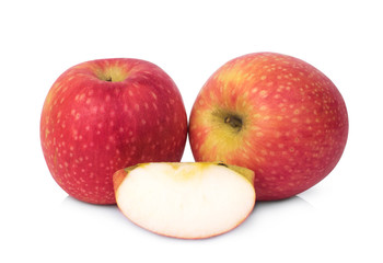 whole and slices pink lady apple isolated on white background