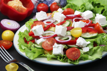 A plate full of bright fresh vegetable salad