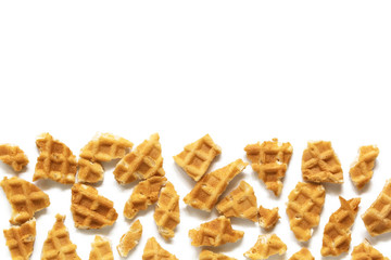 Waffle background. Wafer cone pieces isolated on white
