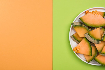 Sliced Cantaloupe Melon Served on Plate, Pastel Background and Copy Space