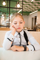 Charismatic girl as a businesswoman in cafe at lunch. Business youth.