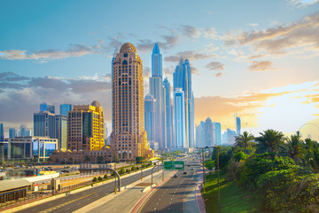 Fototapeta na wymiar Dubai, UAE United Arabs Emirates. Arjaan building and Dubai marina skyscrapers at the background. Hotels and office buildings of UAE