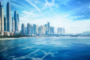  Dubai, UAE United Arabs Emirates. City of skyscrapers, Dubai marina in the sunny day with front line of beach hotels and blue water of Persian gulf  © IRStone
