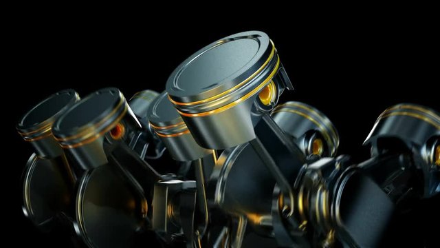 A close-up of engine in slow motion, pistons and valves.