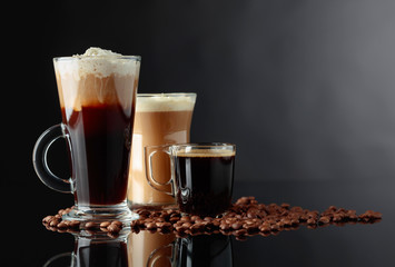 Various coffee drinks on a black background.