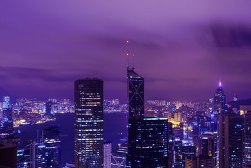 Fototapeta premium Famous view of Hong Kong at twilight sunset, sunrise. Hong Kong skyscrapers skyline cityscape illuminated in the evening. Hong Kong, special administrative region in China. China shopping market. Blue