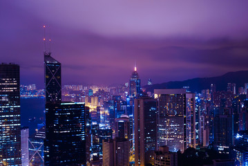 Obraz premium Famous view of Hong Kong at twilight sunset, sunrise. Hong Kong skyscrapers skyline cityscape illuminated in the evening. Hong Kong, special administrative region in China. China shopping market. Blue