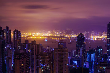 Fototapeta na wymiar Famous view of Hong Kong at twilight sunset, sunrise. Hong Kong skyscrapers skyline cityscape illuminated in the evening. Hong Kong, special administrative region in China. China shopping market. Blue