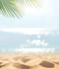 Sand with blurred Palm and tropical beach bokeh background, Summer vacation and travel concept....