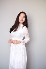 Asian girl with nice outfit, wearing a long lace dress.