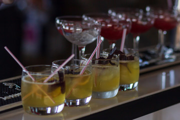 Expert barman is making cocktail at night club
