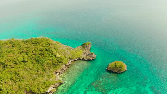 Clear turquoise water in a lagoon with rocky islands and corall reef from above Boracay, Philippines. Summer and travel vacation concept.