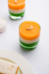 Tiranga / Tricolour sweet food made using indian flag colours and served in a glass in layers....