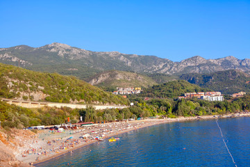 Adriatic coast , people on the sunny beach in Montenegro