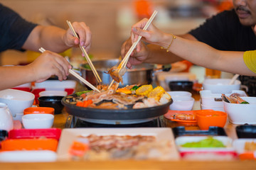 Selective focus Enjoy of Shabu Shabu and Sukiyaki, Japanese food with grill and pot boil