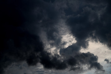 Naklejka na ściany i meble Scenery of black thunderstorm cloudy sky in rainy season.