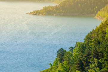 Mountain Lake landscape hills pine forest and clouds summer rest tourism