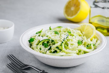Green vegetarian pasta. Spiralized zucchini noodles with mint, lemon and parmesan cheese