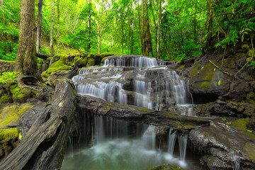 Naklejka na ściany i meble Waterfall in Tropical Rain forest ,Pa Wai Waterfall,Tak Province, Thailand