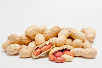 Large peeled peanuts close-up of beans in the shell. Unpeeled peanuts in the shell. Peanuts, for...