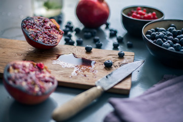 pomegranate juice on on wooden cutting board