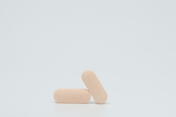 Macro view of pill or tablet isolated over white background