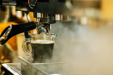 Coffee shop.coffee machine making coffee. Steam and heat.