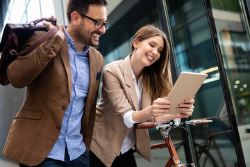 Office woman with business man couple enjoying break while talking flirting outdoor