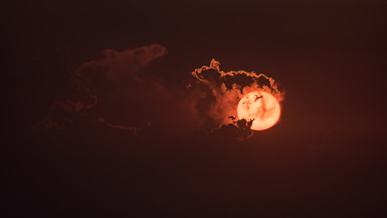 The red sun in the evening with cloud
