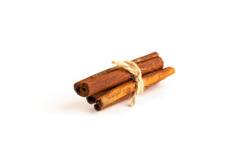 Cinnamon sticks isolated on white background and threaded