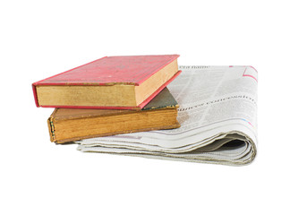 Newspaper and old books on white background.