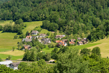 Fototapeta na wymiar View from above to a part of the small village Muenstertal in the Black Forest