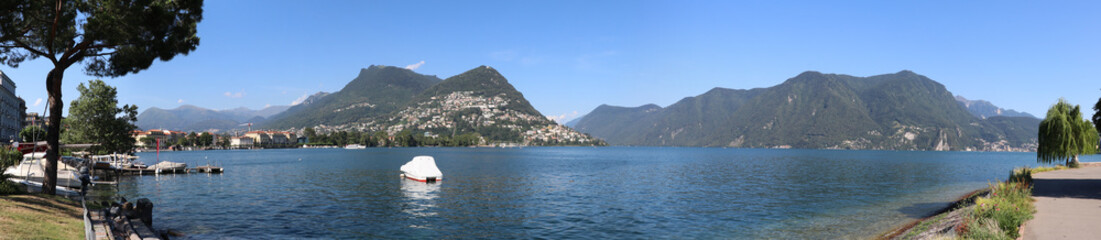 Fototapeta na wymiar Panoramic view of the lake of Lugano with the mountain Bre in the background, Switzerland