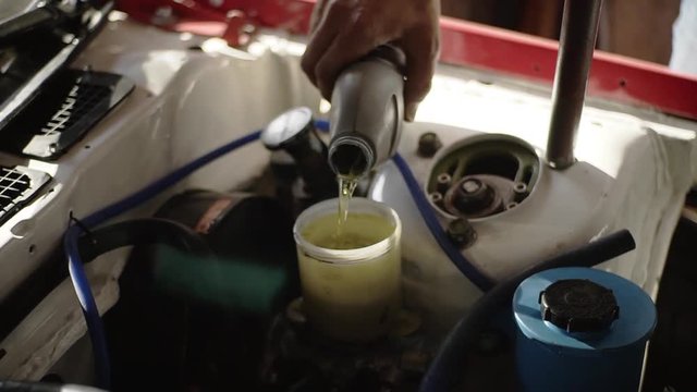 Close up of  oil change in the car