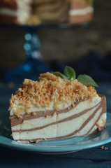 A piece of chocolate and vanilla cheesecake on a plate