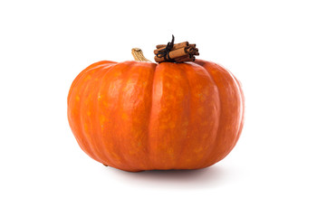 Pumpkin spice latte concept. Large pumpkin and cinnamon sticks, isolated over white