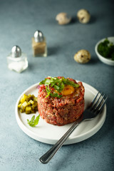 Homemade beef tartare with egg yolk