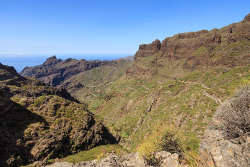 Wide panorama of the Teno mountains gorge serpentine road to the village of Maska in Tenerife. Canary Islands. Spain.