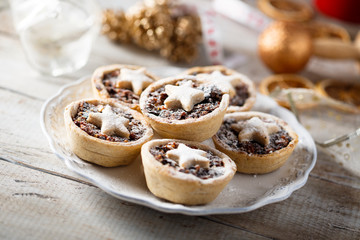 Homemade festive mince pies on white plate