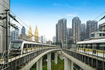 the light rail train shuttles through the city.