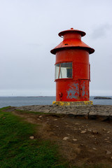 lighthouse on the beach in iceland