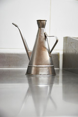 Metallic restaurant oilcan. Professional use stainless container.