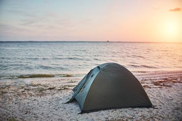 tent on the beach at summer evening