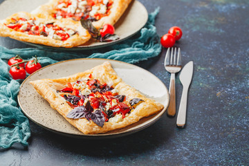 Tomato tarts with addition of aromatic herbs