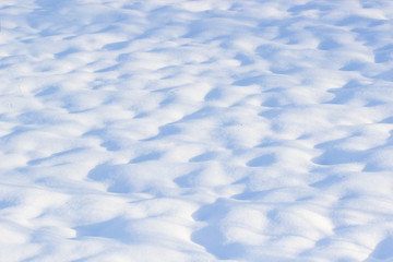 nature background of fresh snow texture in blue tone
