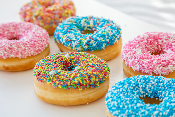 Doughnuts assorted on white. Close up view