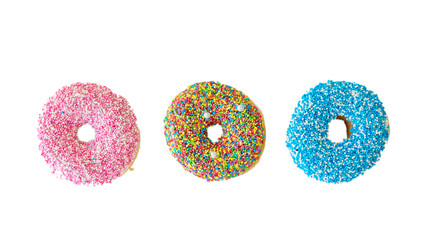 Doughnuts with colorful decoration on white color background. Top view
