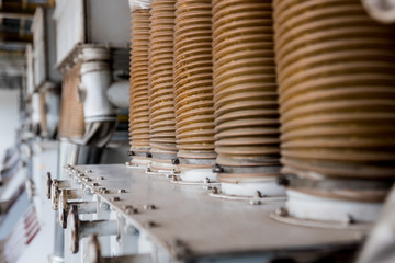 Interior of modern natural oil factory. The piping, pumps and motors